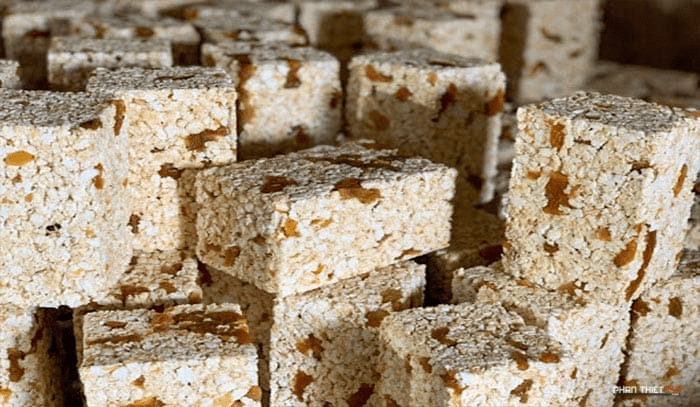 Boxes of golden-brown rice flakes - a specialty of Phan Thiet.