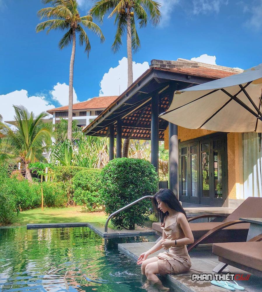 Guests enjoy the resort's swimming pool in the morning.